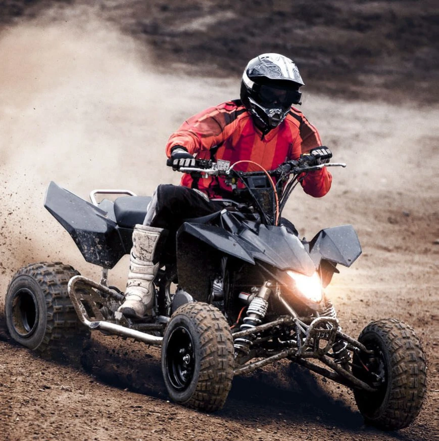 Man on ATV riding in the dirt